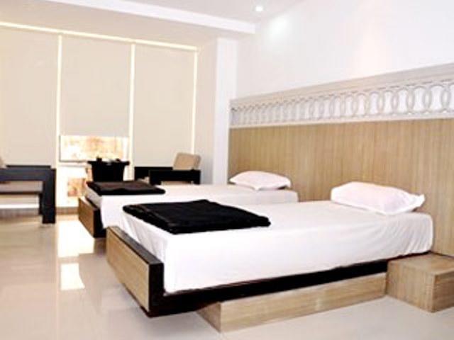 Hiland Inn Calcutta Chambre photo