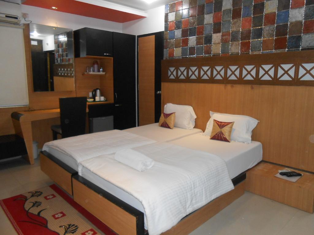 Hiland Inn Calcutta Chambre photo